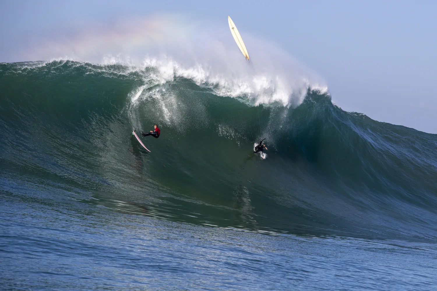 Riding a massive emerald wave at Mavericks, premium big wave surf wall art.