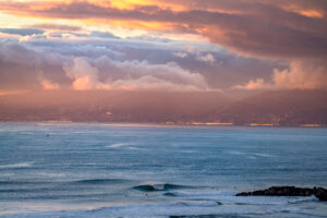 LA  sea cost after storm with multi colored sky and clouds