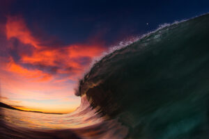 Print art photography of big wave against sunset sky background