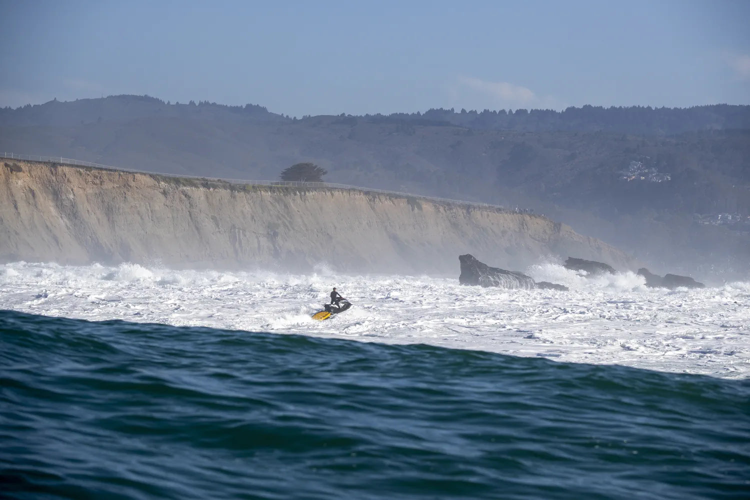 Fred Pompermayer working on Mavericks water safety and photography.