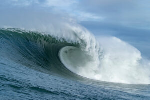 gorgeous photography about bi waves curling over the ocean exploding in white foam