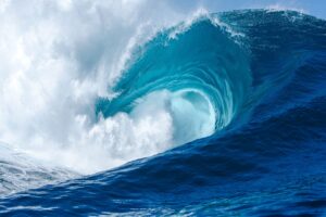 Powerful big wave in the ocean with white foam in  teahupoo,  waimea bay, mavericks