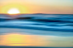 Abstract blurred image of a sunset over water