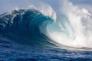 Large big ocean wave with white foam curling over itself  like in Jaws,Maverick, Teahupoo