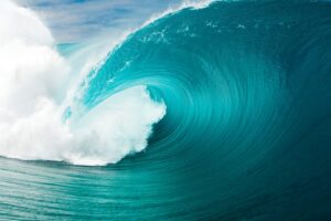 Turquoise big ocean wave with white foam curling over itself, ineffable!