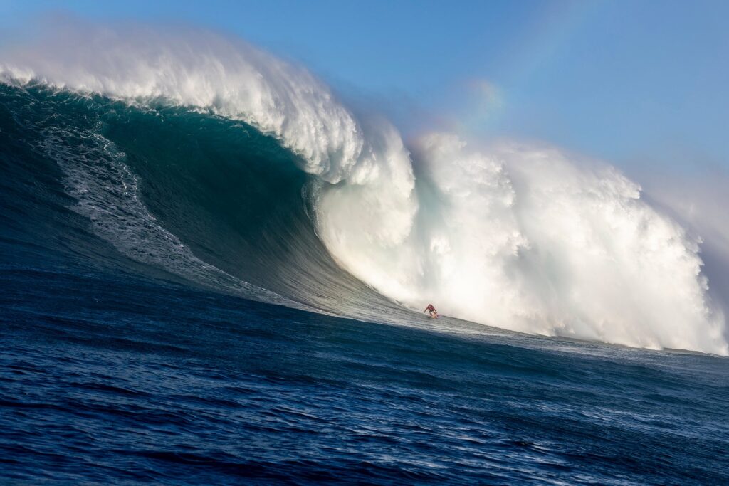 Benjamin Sanchis descending an 80-foot mountain of water at Jaws (Peʻahi) during the historic December 22, 2024 swell.