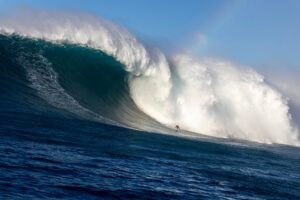Benjamin Sanchis descending an 80-foot mountain of water at Jaws (Peʻahi) during the historic December 22, 2024 swell.