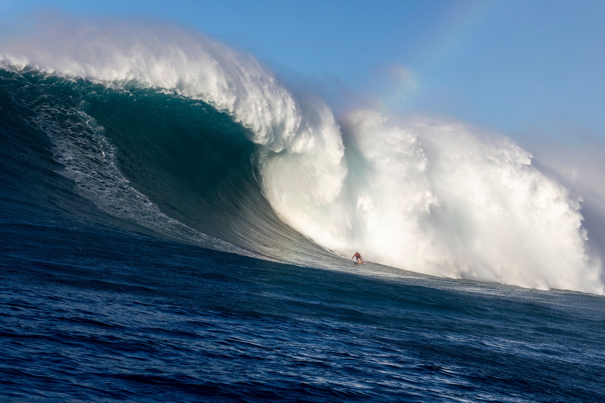 Benjamin Sanchis descending an 80-foot mountain of water at Jaws (Peʻahi) during the historic December 22, 2024 swell.